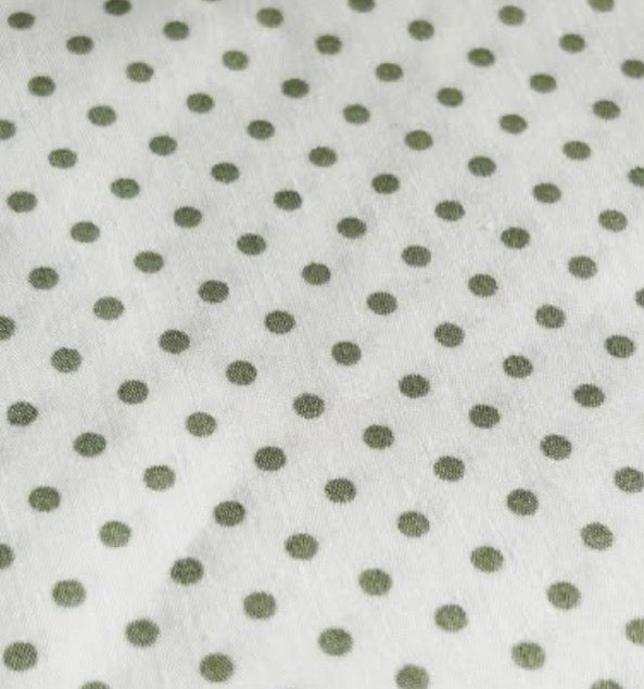 Cotton  poplin fabric Cream with 3mm green spots by Rose & Hubble